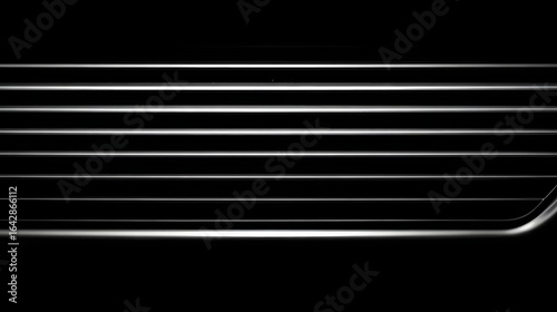 Close-up view of horizontal lines on a vehicle's grill.