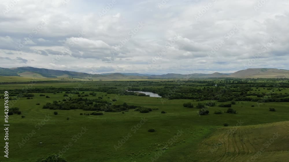 Aerial view of green field and river, Khakassia, Siberia, Russia. Aerial view of green field and river, Khakassia, Siberia, Russia.