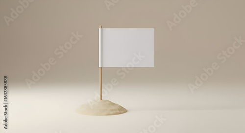 Blank white flag on wooden stick in a small pile of sand on a neutral background. Empty flag mockup in a simple, minimalist aesthetic.