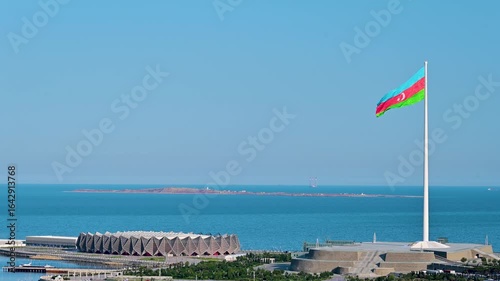 Flag waving over State Flag Square with the Caspian Sea in the background in Baku, Azerbaijan