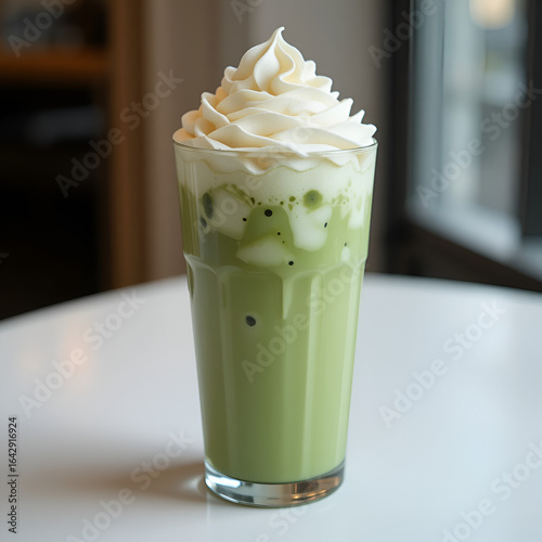 Iced Matcha Latte with Whipped Cream in Tall Glass