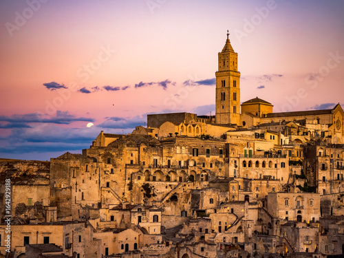 Wallpaper Mural Sunset in the beautiful Sassi of Matera, with stone houses and streets, covered in warm golden light  Torontodigital.ca