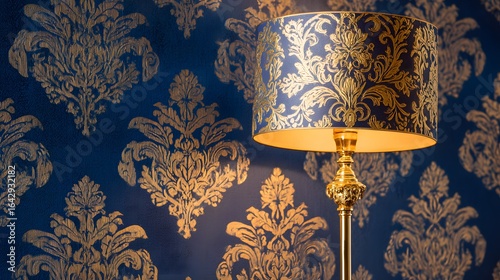 Floor lamp with a navy blue shade featuring gold damask patterns.
