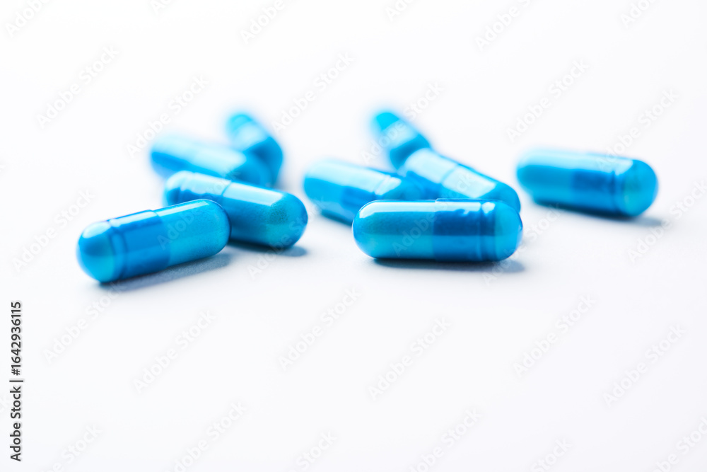 Amino acids capsules on bright background. Soft focus. Close up. Copy space. Amino acids capsules on bright background. Soft focus. Close up. Copy space.