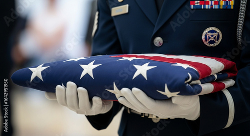An Air Force service member in white gloves respectfully holds a perfectly folded American flag during a solemn ceremony a tribute to honor duty and tradition
