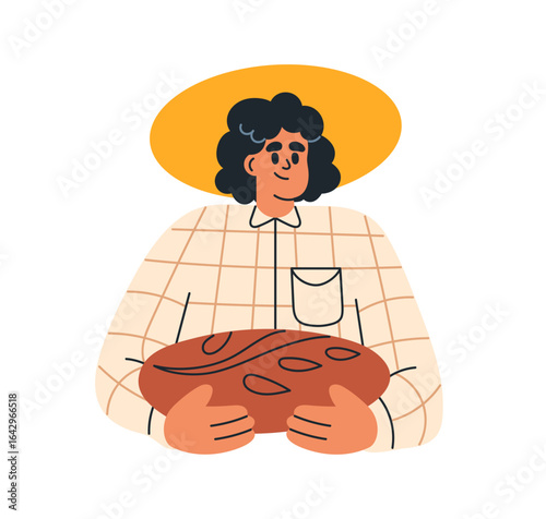 Artisan bread loaf in hands. Baker holding sourdough wholegrain rustic bakery...