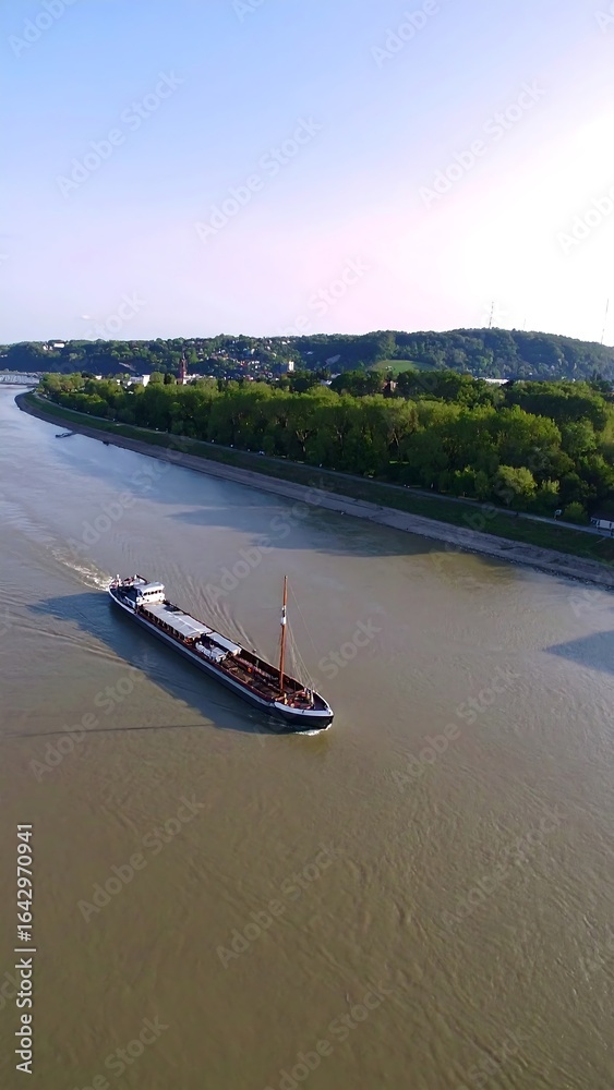 Obraz premium River barge on a tranquil waterway