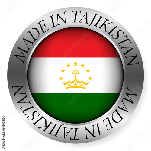 Made in Tajikistan button icon. Circular emblem with metallic border, glossy central flag, and bilingual label indicating product origin and international manufacturing identity.