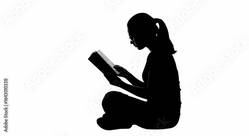 Silhouette of a young woman reading a book stock illustration...