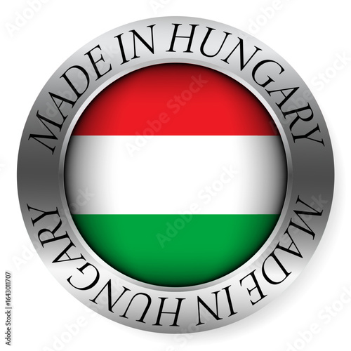 Made in Hungary button icon. Circular emblem with metallic border, glossy central flag, and bilingual label indicating product origin and international manufacturing identity.