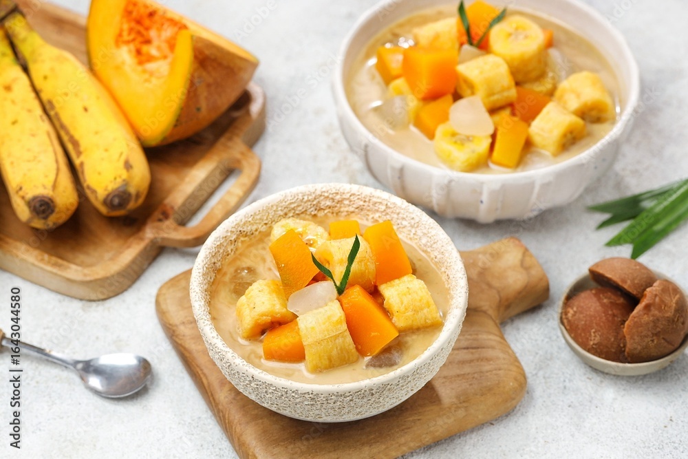 Kolak Pisang is an Indonesian dessert made from bananas, pumpkin cooked with coconut milk, palm sugar and pandan leaves. Kolak Pisang is an Indonesian dessert made from bananas, pumpkin cooked with coconut milk, palm sugar and pandan leaves.