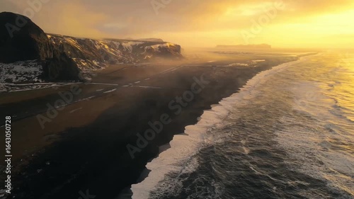 Aerial View of Iceland’s Reynisfjara Black Sand Beach at Sunset