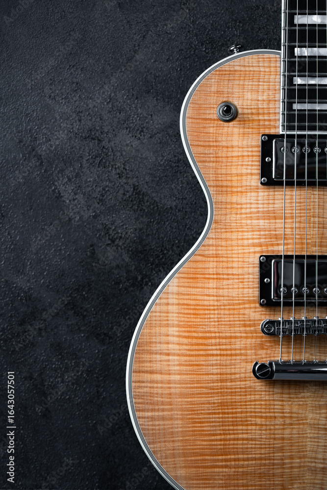 Fototapeta premium Electric guitar with natural pattern isolated on black background.