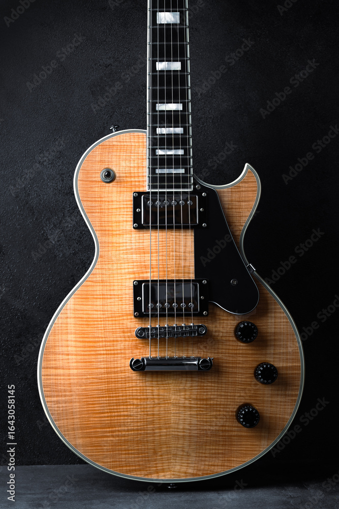 Fototapeta premium Electric guitar with natural pattern isolated on black background.