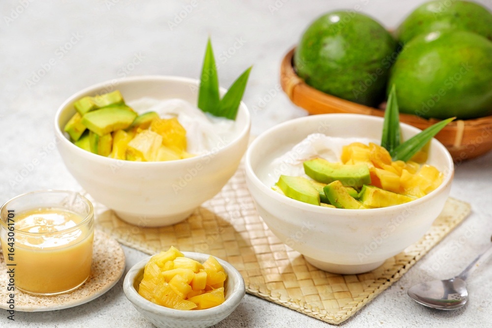 Es teler is an Indonesian fruit cocktail. Avocado, coconut meat, grass jelly, jackfruit and other fruits are served with coconut milk, sweetened condensed milk, and sugar Es teler is an Indonesian fruit cocktail. Avocado, coconut meat, grass jelly, jackfruit and other fruits are served with coconut milk, sweetened condensed milk, and sugar