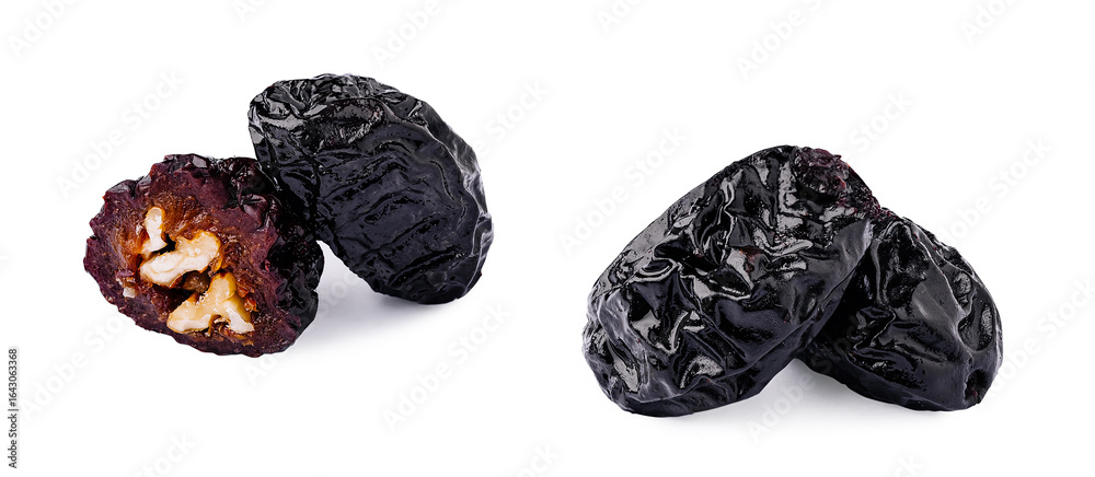 Dried plums with inside texture and dark exterior viewed from different angles Dried plums with inside texture and dark exterior viewed from different angles