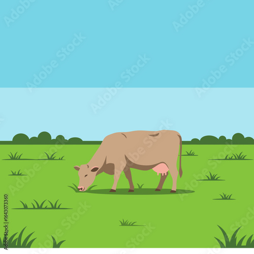 Calm countryside scene featuring a grazing cow on lush green grass under a clear blue sky