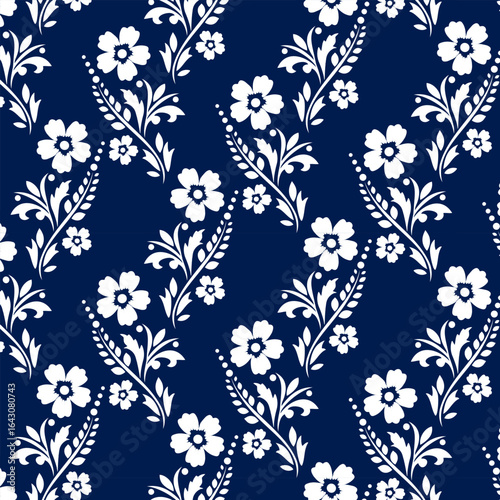Pattern with plant ornament.Vector seamless pattern with white floral ornament on a blue background.