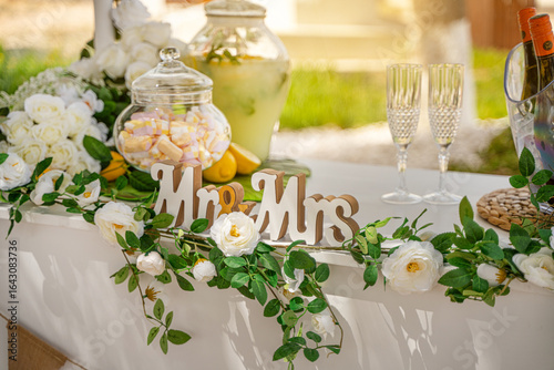 wedding table setting with lemonade marshmallows and champagne glasses 