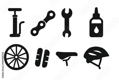 Tools and accessories for bicycle maintenance displayed on a flat surface during daylight hours