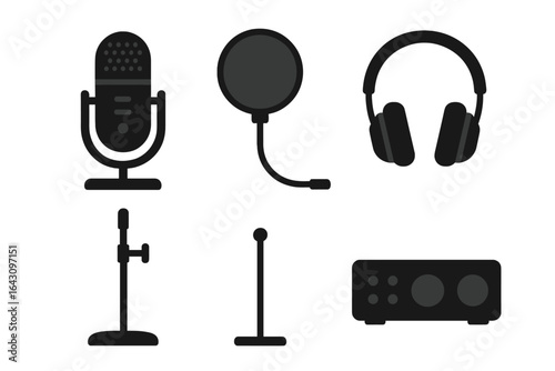 Variety of audio equipment including microphone, headphones, and audio interface in a studio setting
