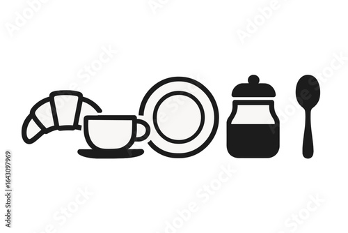 Croissants, coffee cup, sugar jar, plate, and spoon for a delightful breakfast setup in a cozy kitchen