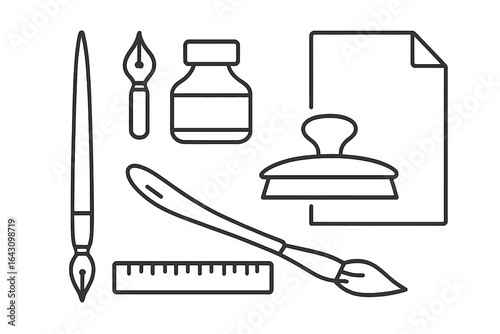 Essential tools for calligraphy and artistic creation displayed on a workspace
