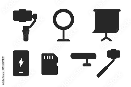 Equipment for content creation and videography setup displayed on a flat surface with various tools and accessories