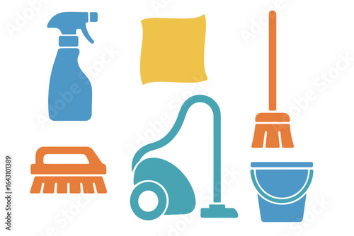 Cleaning supplies and tools arranged neatly on a flat surface for household chores and cleaning tasks