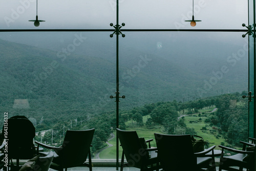 Misty mountains seen beyond the cafe window