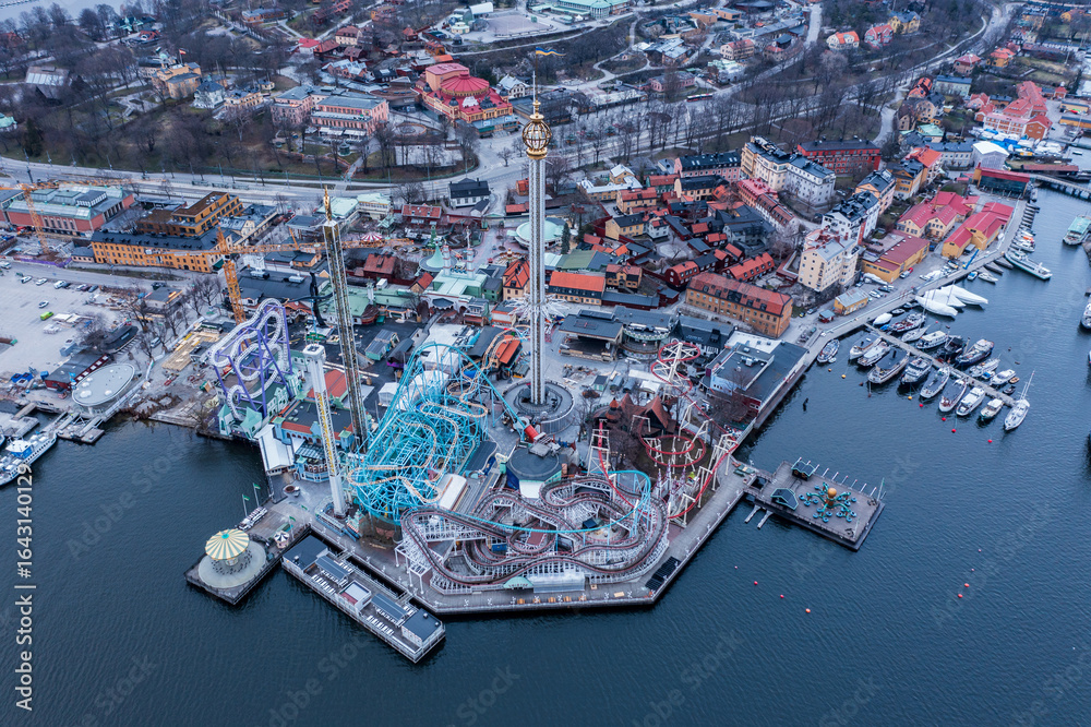 Aerial view of Gröna Lund amusement park with its vibrant rides contrasting against the calm waters of the Baltic Sea, Stockholm, Stockholm County, Sweden. Aerial view of Gröna Lund amusement park with its vibrant rides contrasting against the calm waters of the Baltic Sea, Stockholm, Stockholm County, Sweden.