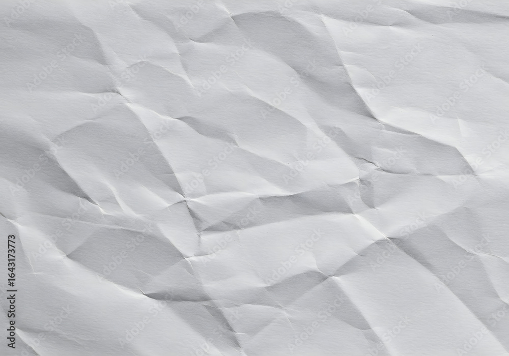 Obraz premium folded wrinkled paper texture background with creases and folds