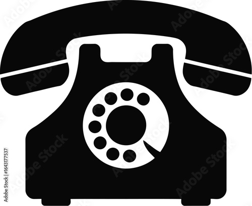 A black rotary phone on white