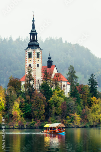 The magical atmosphere of Lake Bled in autumn. Among boats and mystical charm. Slovenia