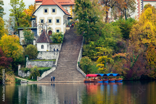 The magical atmosphere of Lake Bled in autumn. Among boats and mystical charm. Slovenia