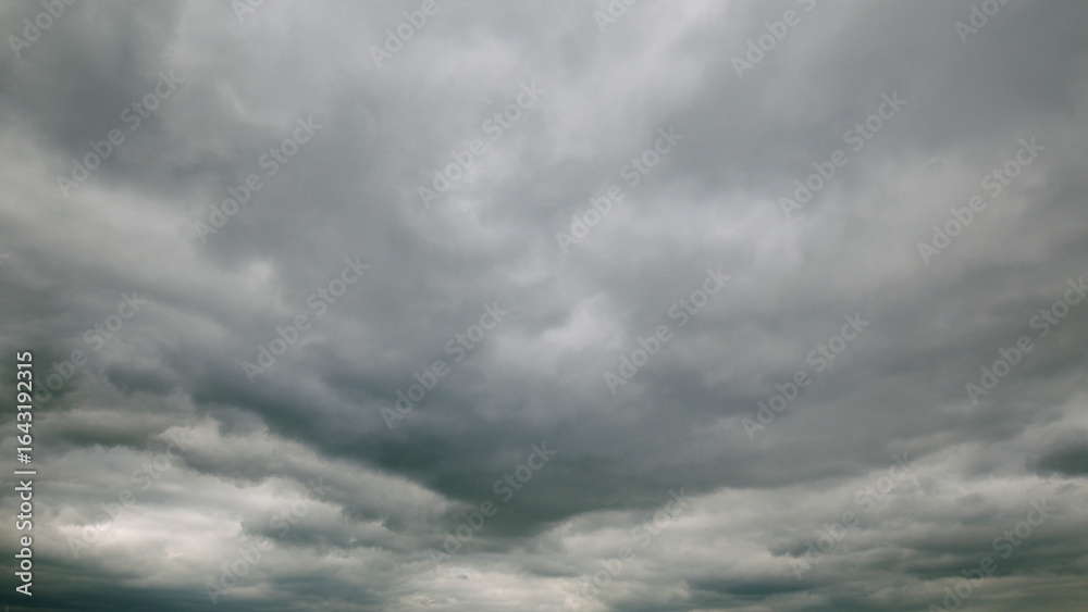 Fototapeta premium A Dramatic Overcast Sky Covered with Thick, Heavy Clouds Creates an Intense Atmosphere