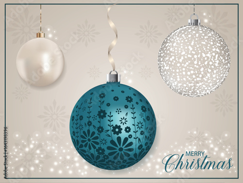A blue pearly Christmas ball with a floral motif.