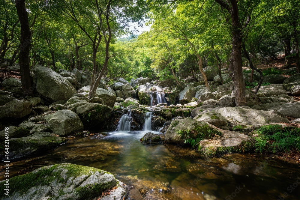 Fototapeta premium Tranquil waterfall cascading through a lush, rocky forest