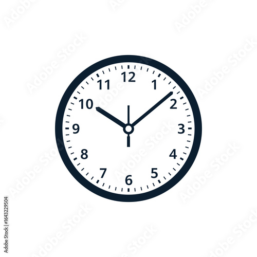 A round clock displays the time with hour and minute hands. The clock face is