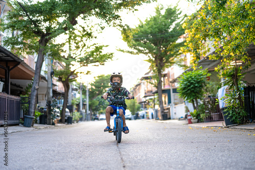 Wallpaper Mural School boy ride bicycle in city town house village Torontodigital.ca