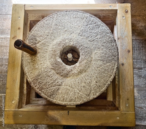 Traditional wheat grinder made of 2 flat, coarse stones also known as , Visurrayi , Vedic hand atta chakki