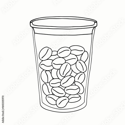 Glass jar filled with coffee beans for artisan brewing and home storage with copy space