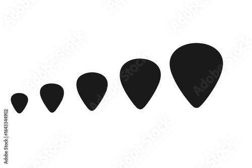 Shapes of black teardrop designs arranged in a graduated sequence on a white background