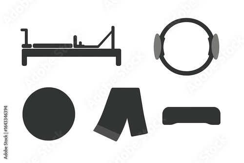 Fitness equipment collection including reformer bed, resistance band, and exercise accessories for home workouts