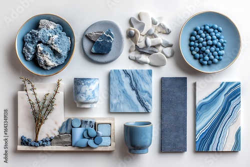 A blue kitchen mood board featuring blue and white materials, including marble and stone samples, showcasing modern design aesthetics.