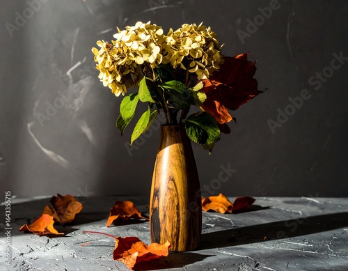 Dried hydrangea in wooden vase, autumnal light