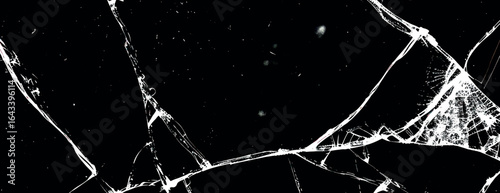 A black background with a cracked texture, creating a striking black and white contrast. The background is dramatic and edgy. Cracked glass background vector. Black background.
