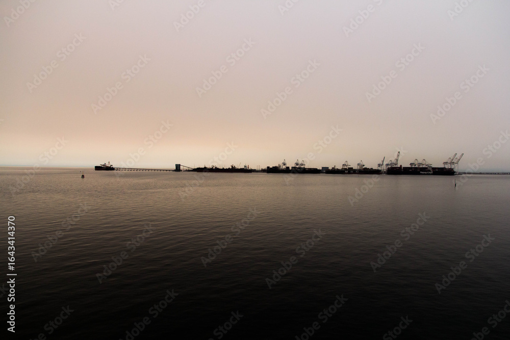 Fototapeta premium Beautiful Sunset Reflected on Calm Lake Waters, Peaceful Landscape Photography