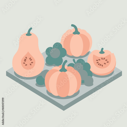 Autumnal gourds and grapes displayed on a gray surface with a simple background. Assortment of pumpkins and squash on a gray surface with abstract geometric background.