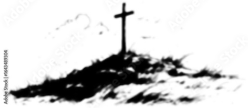 Silhouetted cross on snowy hill in black and white landscape photo